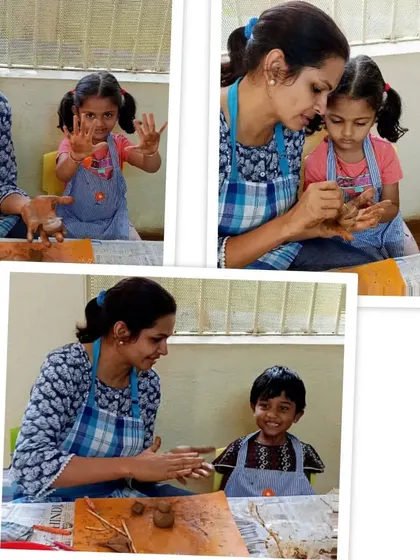 A teacher and children showing off their clay-covered hands. Messy play is happy play!