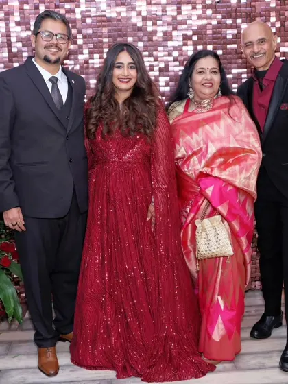 A beautiful family photo from the reception. The bride's look is glamorous yet elegant, and she stands out beautifully.