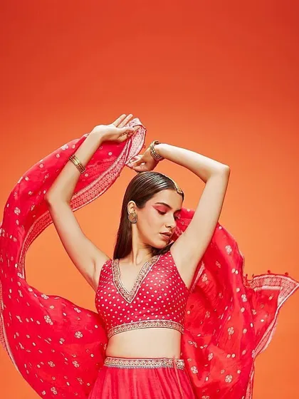 This shot for Three Three Store captures a dynamic pose with a focus on the bold red eye makeup. The look is both artistic and commercial, demonstrating how creative makeup can elevate a fashion catalogue.