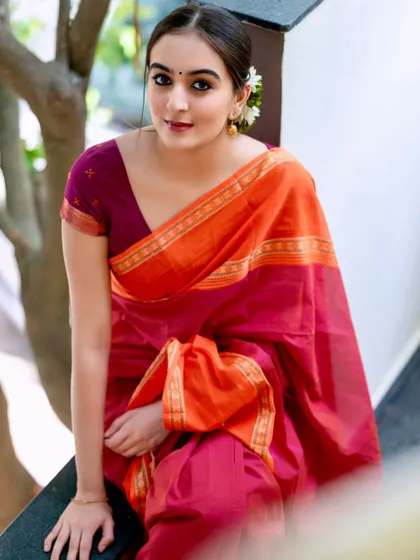 A candid, happy moment. The natural smile and relaxed posture make this portrait feel authentic and warm.