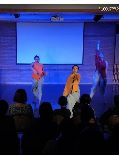 Dancers in motion during the "Open Day with Attakkalari." The dynamic lighting and costumes created a visually stunning experience, fusing Kalaripayattu with contemporary dance.
