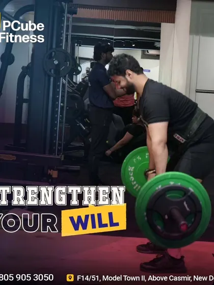 A man strengthens his will by performing a heavy deadlift, a true test of physical and mental power.