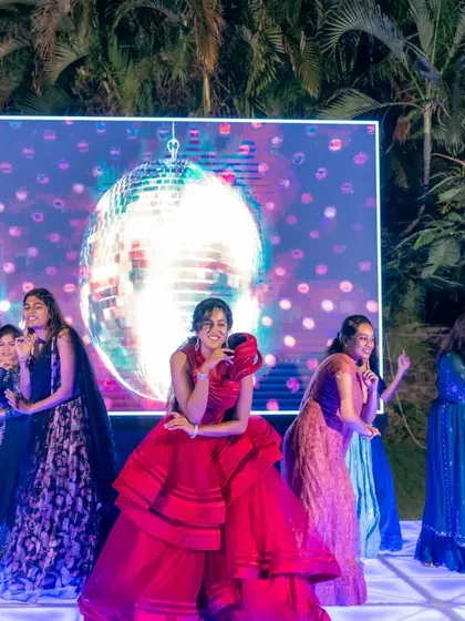 The bride takes center stage, surrounded by her friends, in front of a cool disco ball LED screen. We help you coordinate your performance with the stage decor for a truly spectacular show.