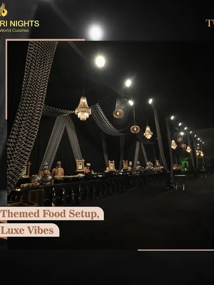 For a modern and chic event, we designed this black-and-white themed food setup, complete with elegant chandeliers and draping, proving our ability to execute a specific aesthetic with luxe vibes.