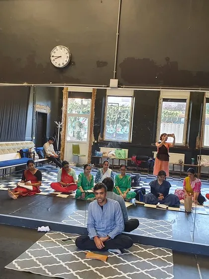 A moment of discussion and learning during a workshop. We often pause to talk about the theory and emotion behind the movements.