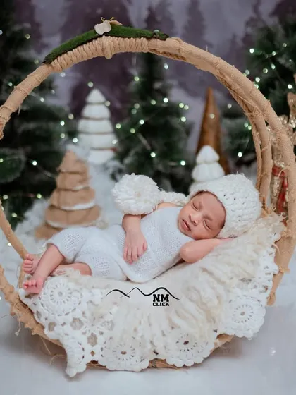 A tiny snow baby sleeping peacefully in a winter wonderland. Our themed newborn sessions create beautiful, artistic portraits for you to cherish.