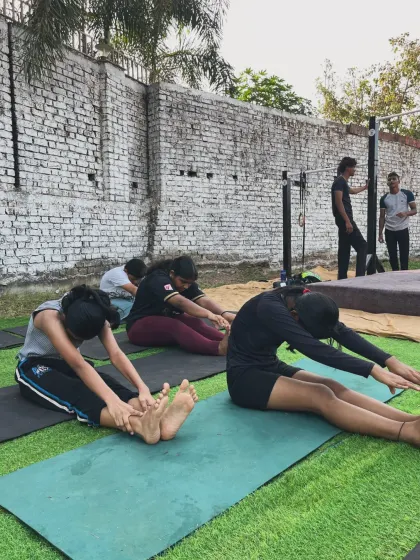 A powerful morning at our outdoor park. Members are working on flexibility and strength as the day begins.