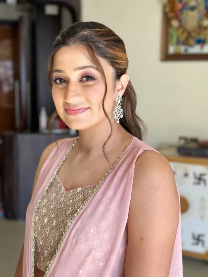 A close-up of her soft and pretty makeup. The focus is on creating a natural, healthy-looking glow that makes her feel polished and confident.