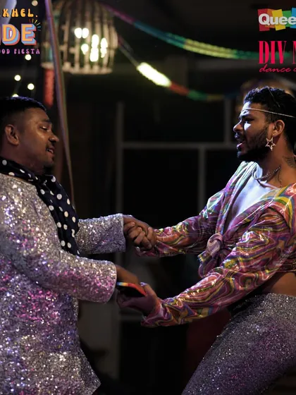 Two performers sharing a dance at our Pride fiesta. These events are about connection and celebrating together.