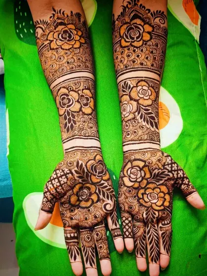 This full-arm design is a celebration of flowers, with large rose motifs repeated from the palm to the elbow.