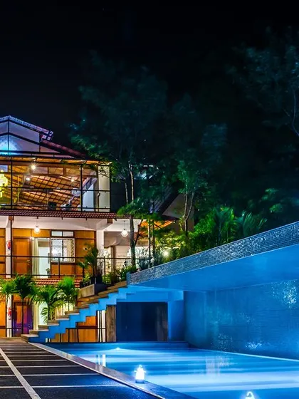 Our stunning poolside at Nandi Hills, beautifully lit up at night, offers a serene ambiance for evening relaxation or group gatherings.