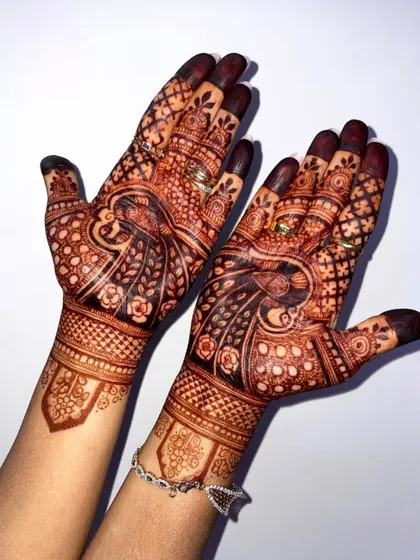 Another look at a beautifully developed henna stain. The peacock and floral motifs have taken on a deep, rich color that will last through all the wedding festivities.