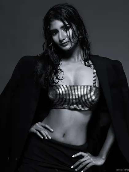 A black and white version of a model with the "wet look," creating a moody and dramatic image.