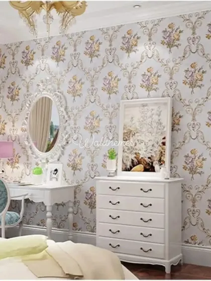 A classic floral damask wallpaper in a bedroom with vintage-style white furniture, creating a romantic and feminine look.