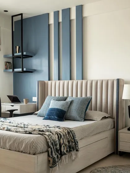 An identical shot of the master bedroom, emphasizing the calm and balanced design. The integrated desk and floating shelves offer a practical work-from-home solution without cluttering the space.