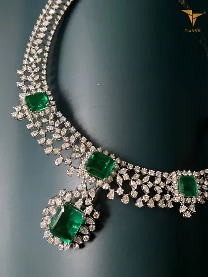 For the woman who appreciates refined elegance, this necklace is crafted to add a luxurious touch to your festive ensemble. The arrangement of diamonds and emeralds is classic, captivating, and truly unforgettable.