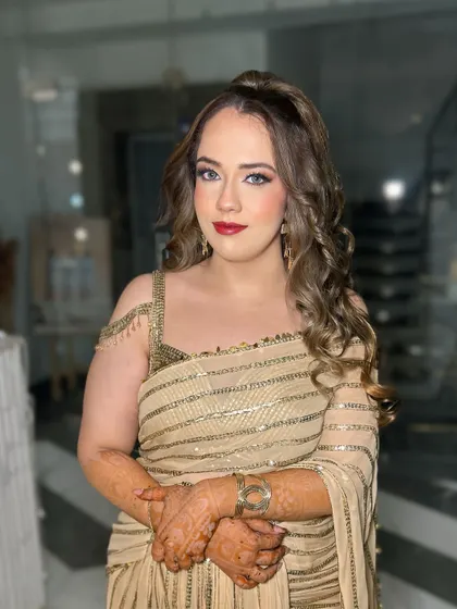 Another view of this classic party look. The combination of red lips and soft glam eyes is always a winning choice for any celebration.