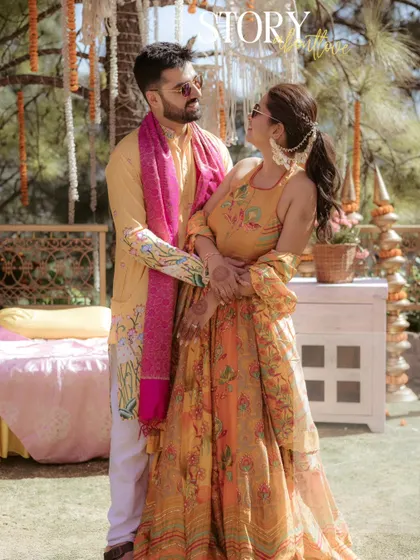 A classic couple portrait from Jhalak and Aayush's Haldi. Even in the midst of the fun, we take a moment to create a beautiful, composed shot that they can cherish.