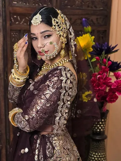 This image highlights a beautiful side profile, showcasing the intricate passa (side tikka) and nath from one of my custom bridal sets.