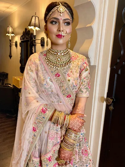A close-up of this Sabyasachi bride's look. The dramatic kohl-rimmed eyes are balanced with a soft pink lip and a flawless skin finish for ultimate bridal allure.