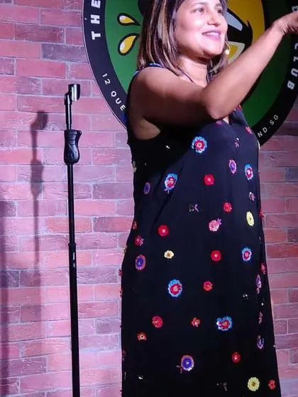 A shot of me mid-performance in Singapore. I love the energy of international audiences and the challenge of making people from different backgrounds laugh together.