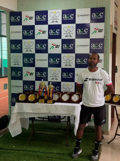 Standing with the trophies before the award ceremony at the Ace Tennis Academy tournament in Ahmedabad.