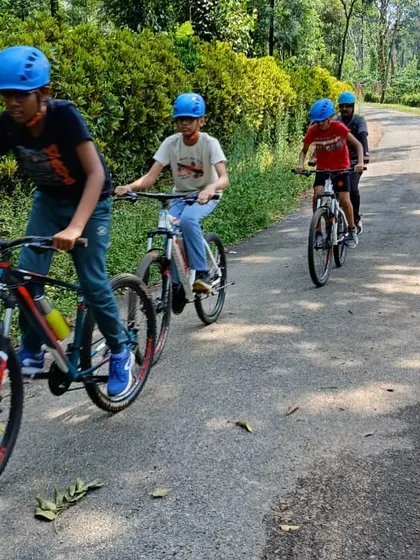 Young adventurers take on the winding trails through Coorg's coffee estates on our mountain biking expedition. This activity is a highlight of our Barapole camp, combining physical challenge with the beauty of the Western Ghats.