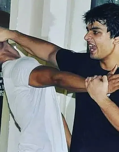 This image captures the intensity of a real fight. I teach you to target an opponent's vulnerable areas to end the conflict as quickly as possible. Victory belongs to those who are willing to do what is necessary.