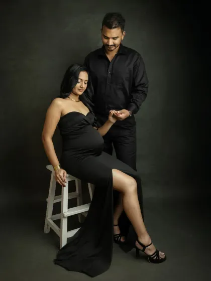 A tender moment in the studio. The way you hold hands and look at each other shows the deep connection you share, captured in a classic and elegant setting.