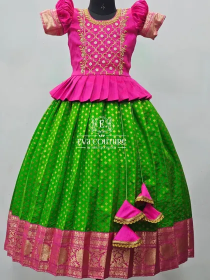 Another view of the green and pink peplum lehenga. The simple butti work on the green skirt adds a touch of elegance to the vibrant outfit.