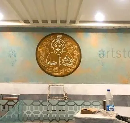 This textured wall finish was created for a restaurant, featuring their logo as a central gold-leaf emblem. Combining texture painting with line art gives the wall a unique, rustic, and premium feel.