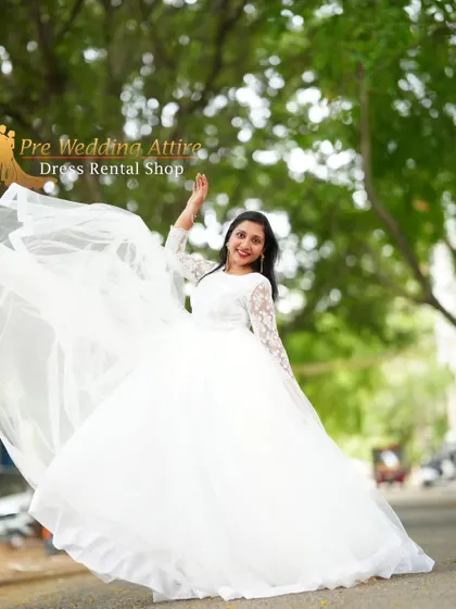 A joyful, twirling shot in the white ball gown, showing the light and airy movement of the full tulle skirt.