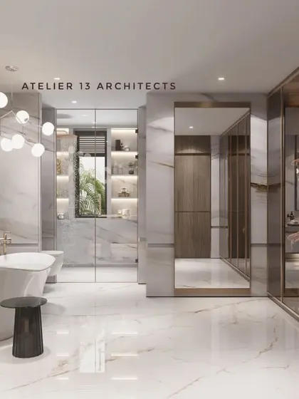 This master bathroom combines opulence and function with floor-to-ceiling white marble and a freestanding bathtub set against a dramatic piece of art. The adjoining walk-in closet features glass and bronze-trim doors, offering a seamless transition from personal care to bespoke storage.
