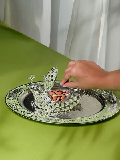 A closer look at the functionality of our peacock dry fruit box. The lidded container keeps treats fresh, while the elegant design ensures your hospitality is always served with a touch of grandeur.