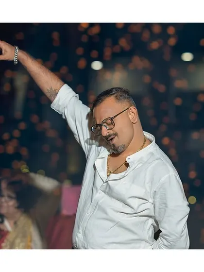 Pointing to the sky and feeling the music. A great candid shot of a guest owning the dance floor.