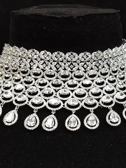 A close-up view of the intricate web-like design of this American diamond choker, a testament to the quality of our rental collection.
