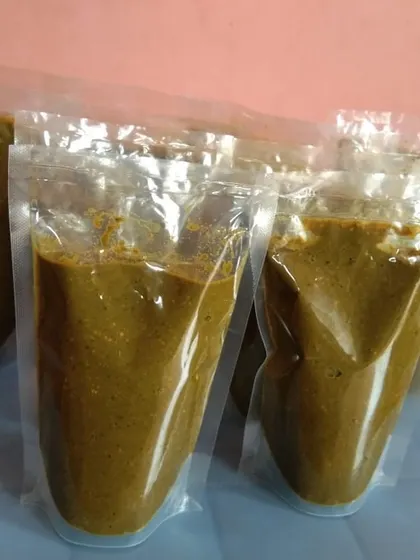 Pouches of my homemade Goan green curry paste, Cafreal. It's a vibrant and herby paste perfect for making the classic Goan chicken Cafreal.