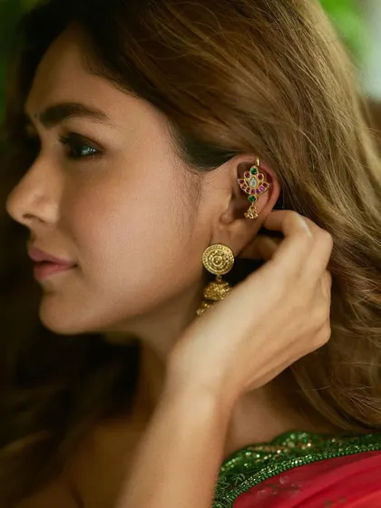 The lovely Mrunal Thakur adorning our Alayaa Earcuff and jhumkas, a perfect example of how to mix modern and traditional pieces.