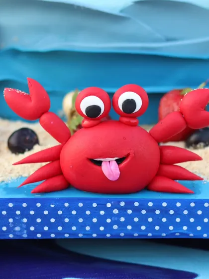 Another shot of the playful fondant crab, perfect for any beach or under-the-sea themed cake.