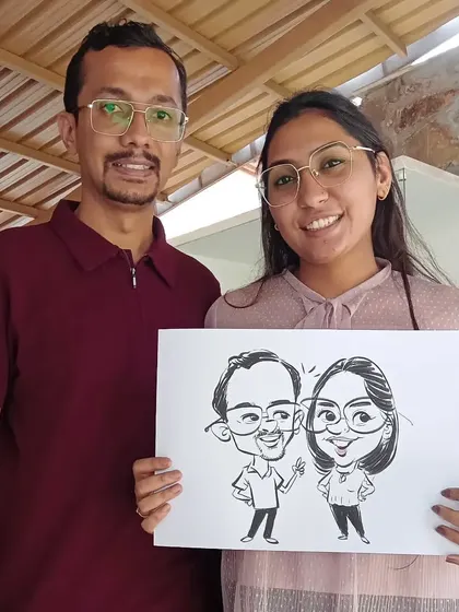 This couple's caricature captures their fun-loving spirit. I enjoy creating full-body drawings that tell a little story about the subjects.