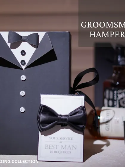 A classic groomsmen hamper presented in a tuxedo-themed gift box. It's a stylish way to ask your best guys to suit up for your big day.