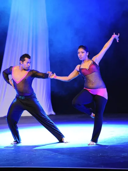 An early performance shot under the stage lights. You can see the focus and connection between us, even in the early days of our 15-year dance journey.