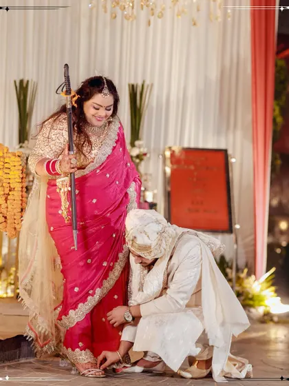 A playful and traditional moment from the wedding ceremony, capturing a fun ritual between the bride and groom.