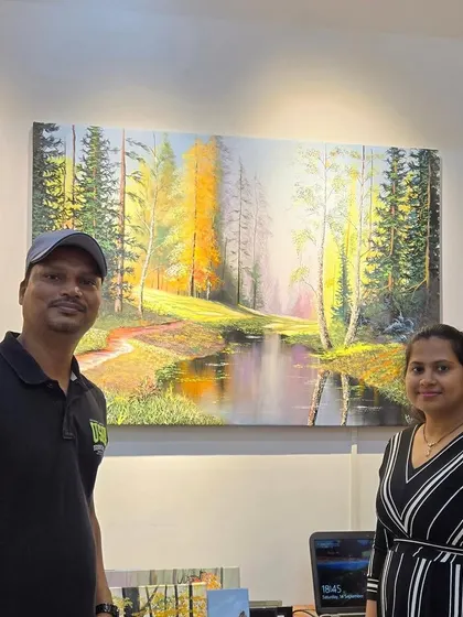 A happy returning art collector with his new landscape painting. We value the relationships we build with our clients and love helping them grow their collections over time.