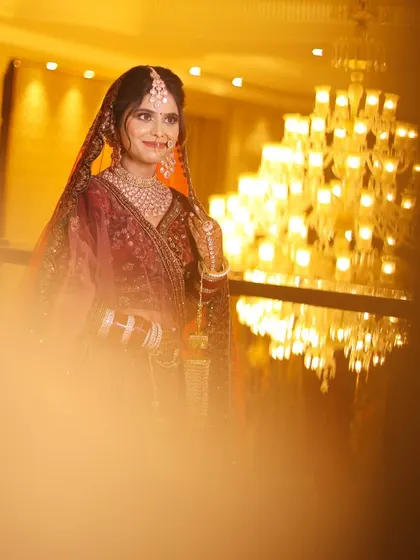 A classic bridal portrait, with the bride framed by a soft, warm light.