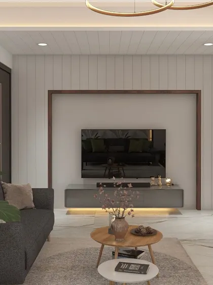 This is a great example of a compact living area that feels spacious and stylish. The light color palette, vertical wall paneling, and minimalist furniture create a clean, modern aesthetic.