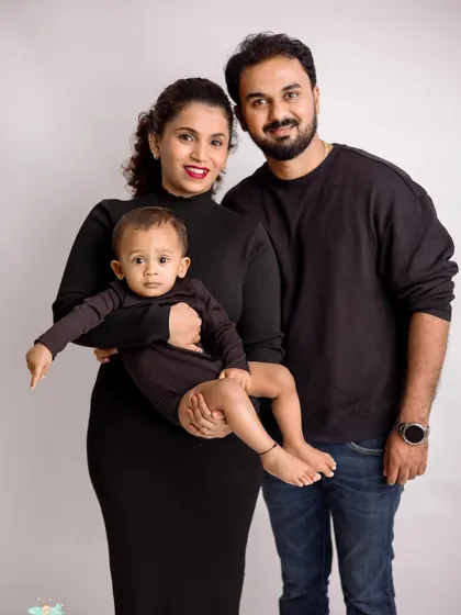 A beautiful family of three. We aim for portraits that feel natural and connected, capturing the unique bond you share.