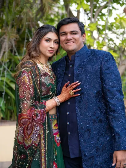 A lovely couple portrait from the Mehendi. The bride's makeup is soft and romantic, a perfect complement to her intricately printed lehenga.