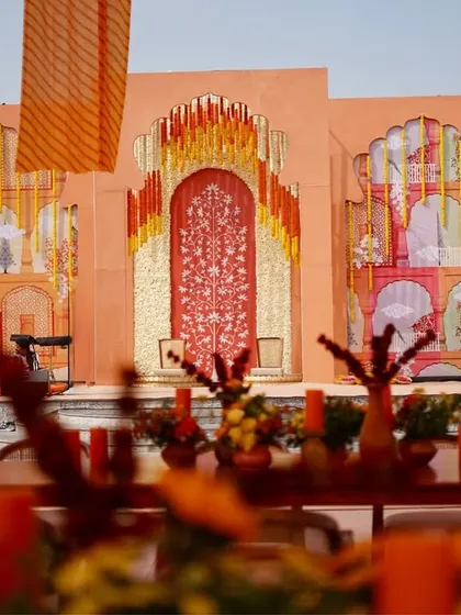 A closer look at the stunning, custom hand-painted backdrop that served as the focal point for the stage. The artwork, depicting traditional 'jharokhas' and motifs, added a unique, artistic touch.