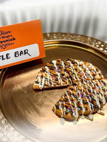 Our live Waffle Bar is always a hit. Freshly made waffles are served warm and topped with chocolate sauce, white chocolate, and sprinkles for an irresistible treat.